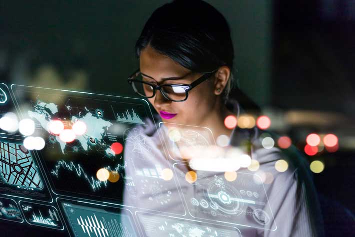 Woman analyzing futuristic digital interface