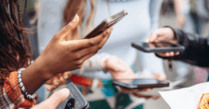 Group of people holding smartphones